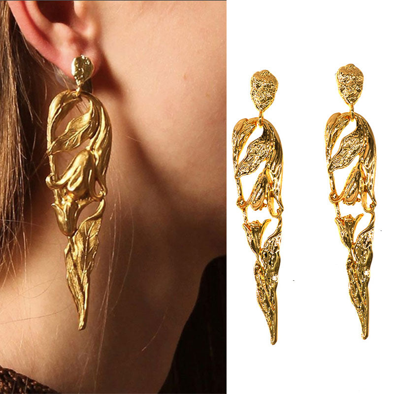 Metal atmospheric human-shaped earrings