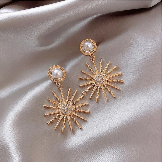 Sun gods pearl earrings